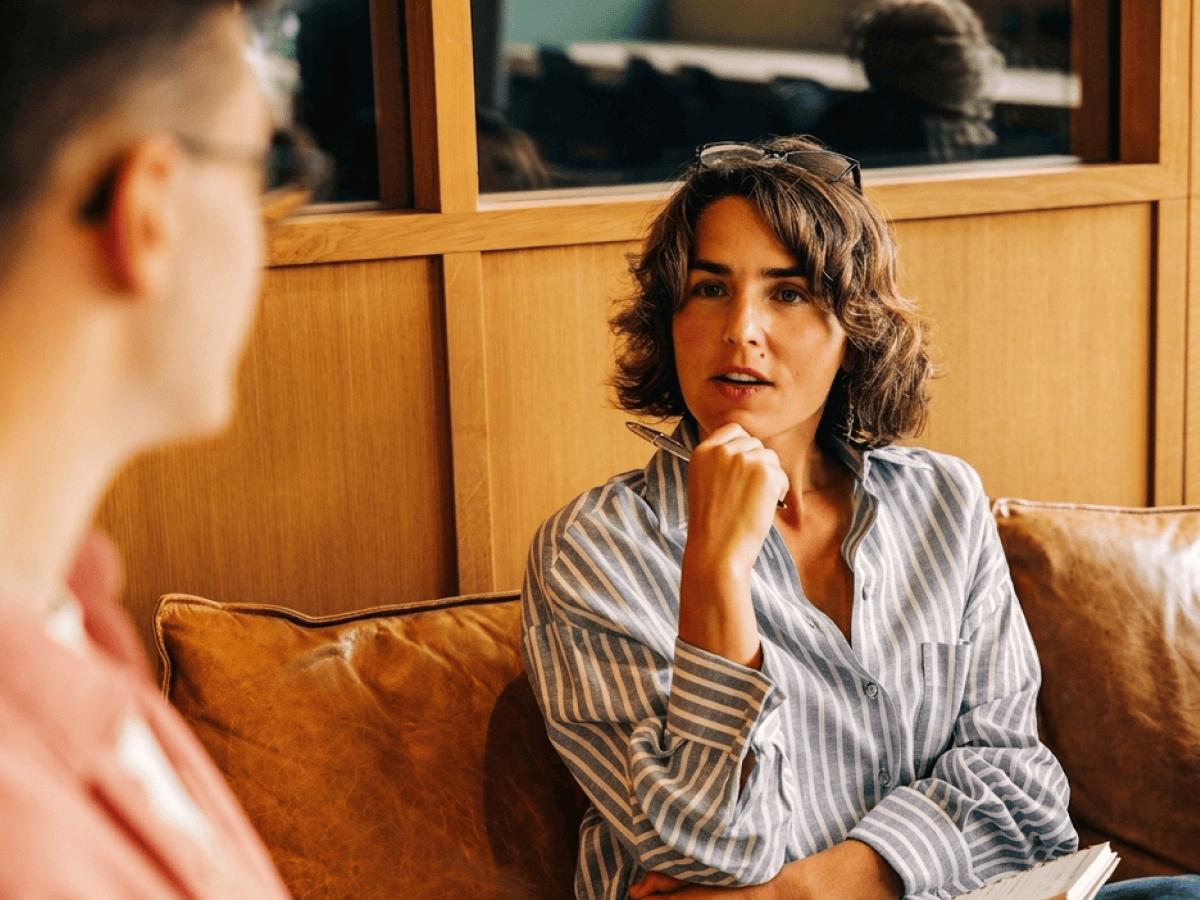 Woman listening thoughtfully in a meeting