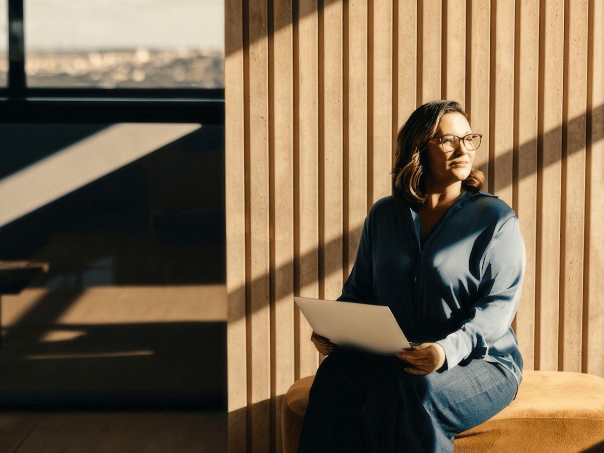 Woman working on a laptop in a modern office