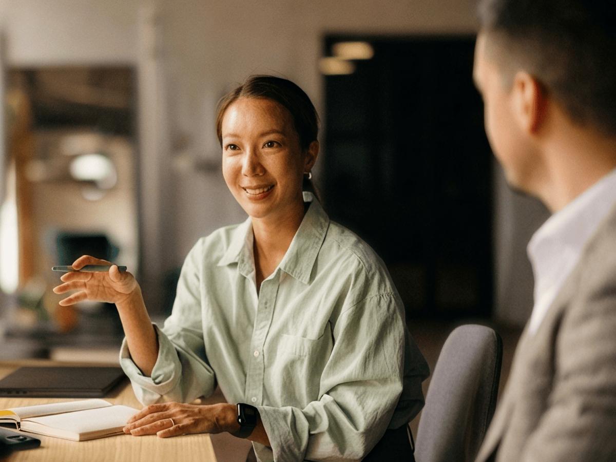 Smiling woman in a meeting with a colleague