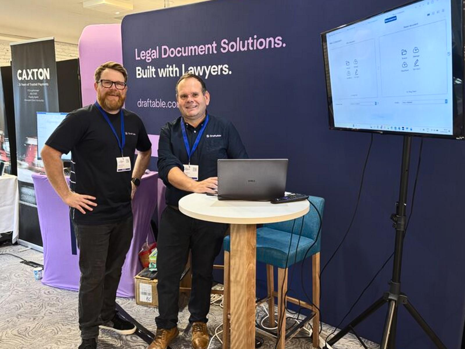 Two Draftable team members at the Draftable exhibition booth