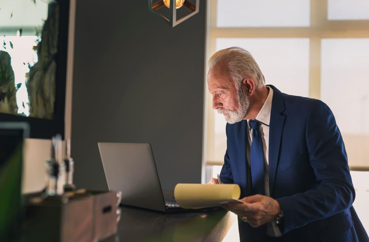 Senior lawyer reviewing documents at a desk