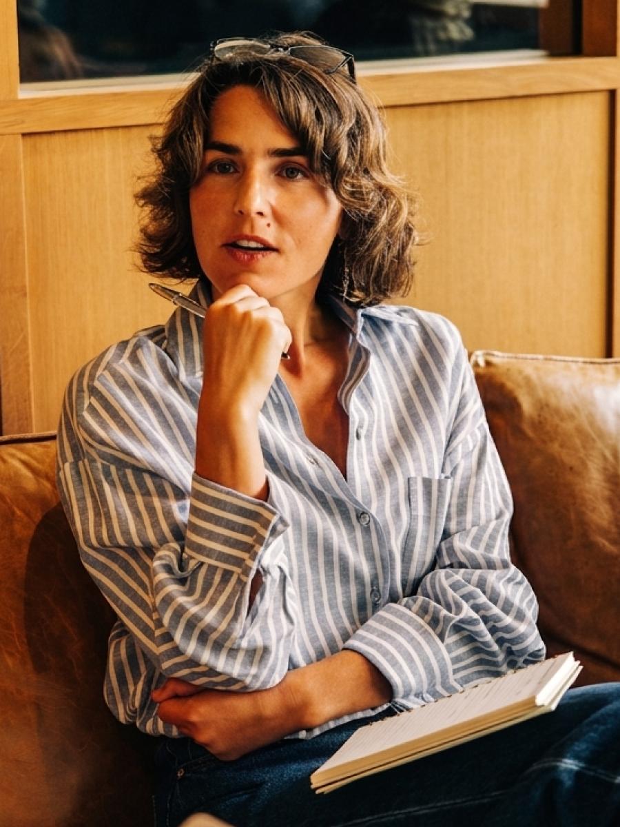 Woman listening thoughtfully in a meeting