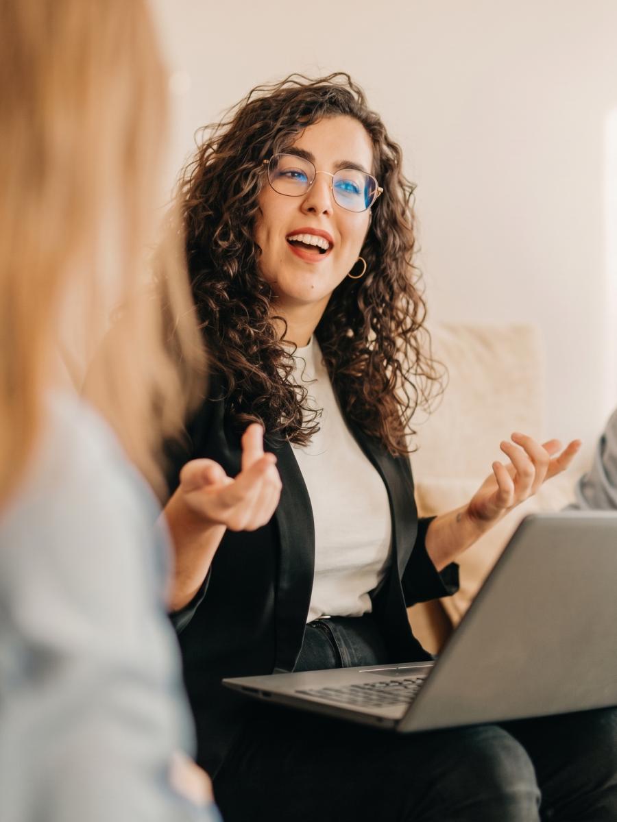 Woman laughing during a conversation