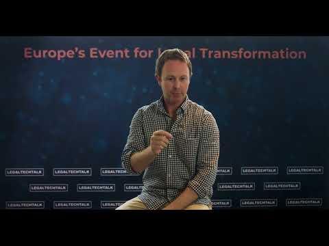 Speaker presenting at a legal transformation conference