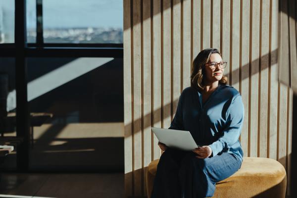 Woman working on a laptop in a modern office